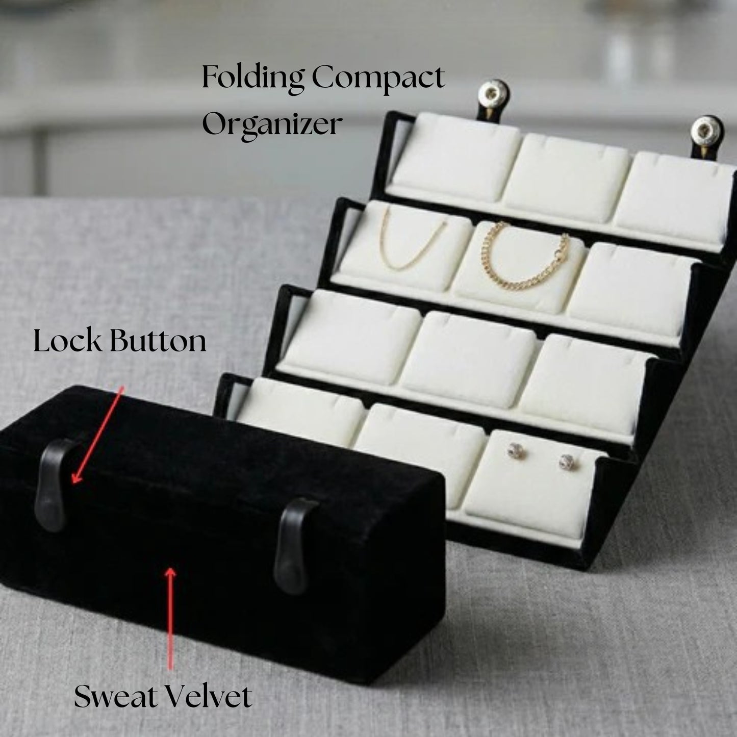 Black folding compact organizer with white interior, showing jewelry storage capacity.